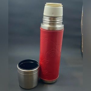 Starbucks Thermos with removable red leather sleeve.